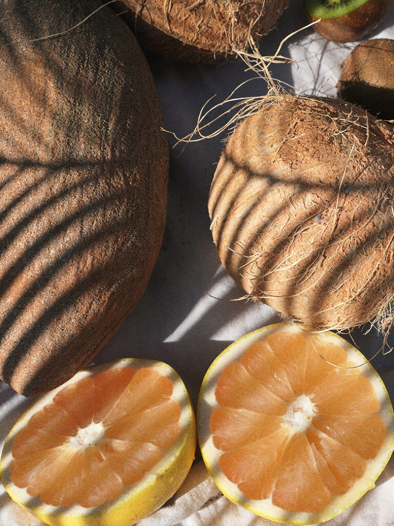 image of coconuts and cut oranges